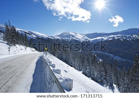 Winter Drive in Colorado. Mountain Road Covered by Snow and Ice. Colorado, United States.