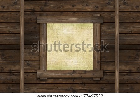 Blank Wall Canvas Frame on Vintage Reclaimed Wood Wall. Wooden Background with Copy Space on Canvas.
