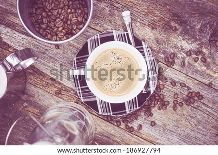 Elegant Coffee Cup on Wooden Table. Top View. Ultraviolet Color Grading.