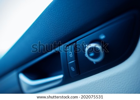 Modern Car Door Lock Buttons Closeup.