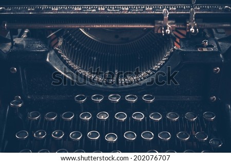 Aged Retro Typewriter in Dark Blue Color Grading. Typewriter Front View.