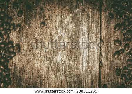 Browny Coffee Background. Coffee Beans on Aged Reclaimed Wood Boards. Browny Vintage Color Grading.
