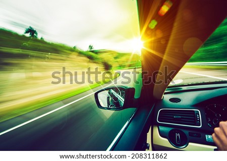 Driving Down the Road. Road to the Sun. Modern Car Driving.