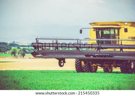Agriculture Works. Yellow Harvester in Work. United States. Agriculture Technology.