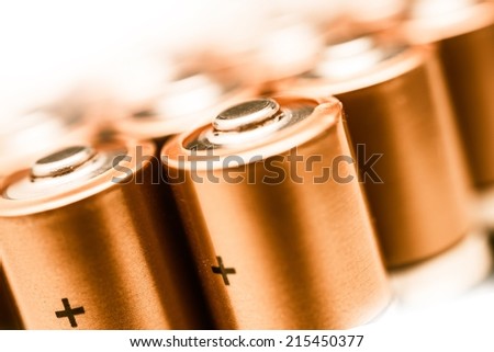 AA Batteries Closeup on a White Background. Batteries Technology. Power Industry.