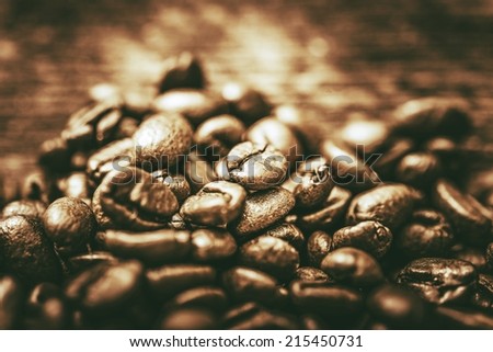 Golden Coffee Beans. Cafe Concept. Coffee Beans Closeup.