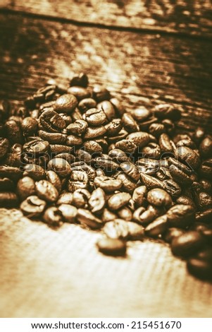 Freshly Roasted Coffee Beans Closeup Photo. Vintage Color Grading Coffee Concept.