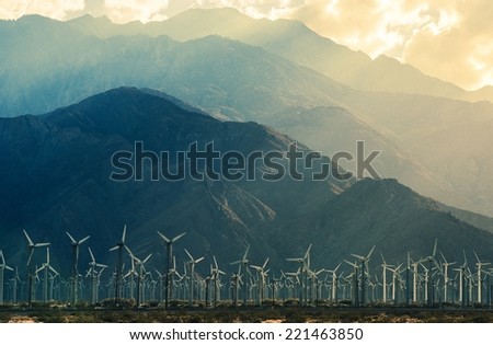 California Desert Wind Turbines in Coachella Valley. Scenic Mountains and Sun Light. California, United States.