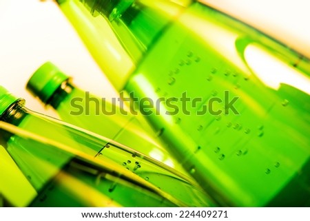 Mineral Water Green Bottles Closeup. Sparkling Water.