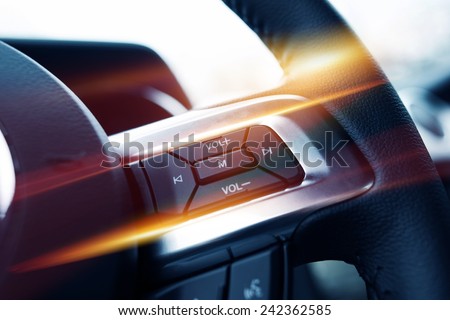 Steering Wheel Music Control. Car Stereo Steering Wheel Control Buttons Closeup.