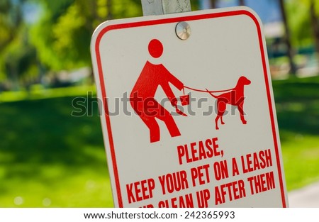 Clean Up After Pet Sign. Please Keep Your Pet on Leash and Clean Up After Them. Park Sign.
