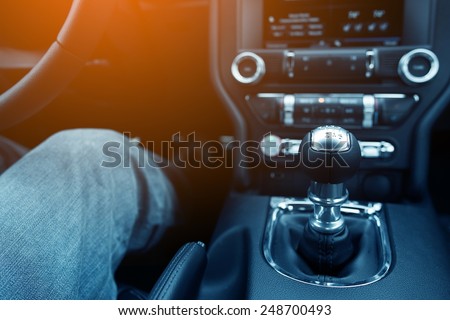 Stick Shift Driver. Driver in the Modern Compact Car with Manual Transmission.