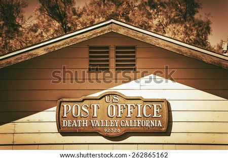 United States Post Office Death Valley. Post Office Building Wooden Sign. Vintage Color Grading.