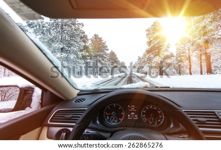Icy Road Winter Drive. Winter Conditions on the Road with Sunny Sky. Driver View.