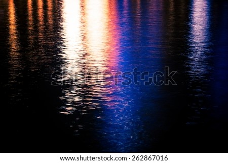 Colorful Urban Water Reflections Photo Background. Water Reflections At Night.