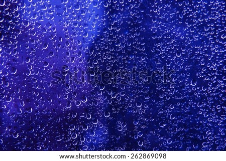 Blue Water Beads Background. Blue Wet Glass Photo Backdrop.