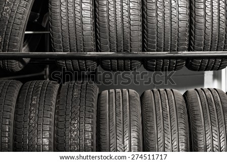 Large Metal Tires Rack. Modern Car Tire Service and Sale.