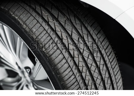 Brand New Car Tire Closeup Photo. Modern Car Tire
