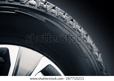 Off Road Tire and Alloy Wheel Closeup Photo.