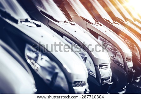 Cars in Stock Closeup. Row of Brand New Cars For Sale. New Cars Industry.