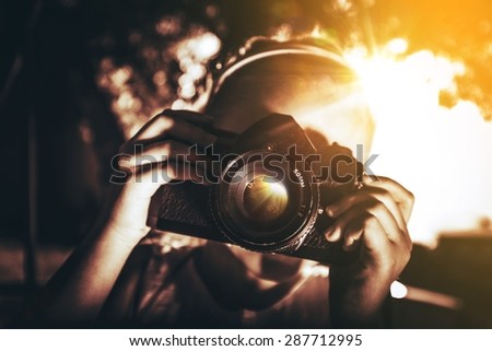 Girl with Vintage Camera Closeup. 7 Years Old Caucasian Girl Taking Pictures.