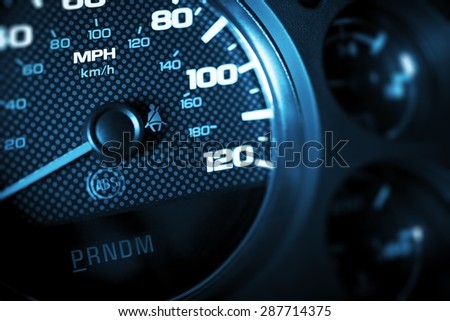 Driving Speed Control. Car Tachometer Closeup. Dark Blue Color Grading.