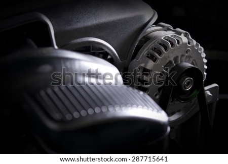 Car Alternator Closeup Photo. Modern Car Electric Generator Device.