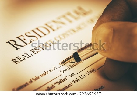 Signing Residential Real Estate Contract Closeup Photo. Real Estate Business Concept.