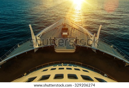 Cruise Ship Ocean Crossing. Sunset Scenery. Large Cruise Vessel. Ocean Liner. Marine Transportation.