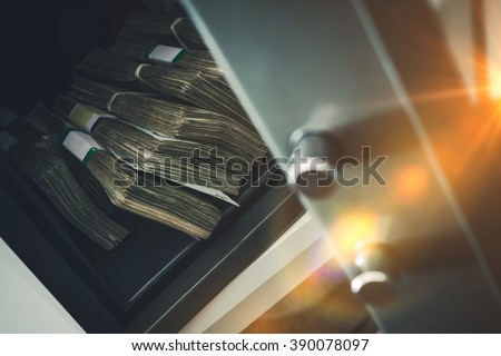 Cash Money Safe Deposit. Small Residential Vault with Pile of Cash Money. Closeup Photo.