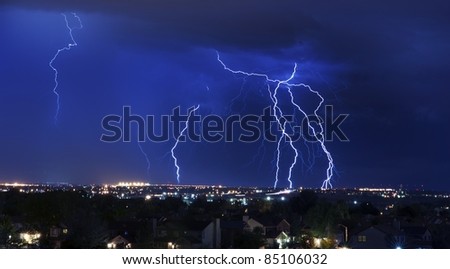 Lightning Storm Over South-West Colorado Springs, Colorado, USA. Overnight Heavy Thunderstorm - City, Storm Cloudscape and Few Lightnings. Powerful Nature Photo.
