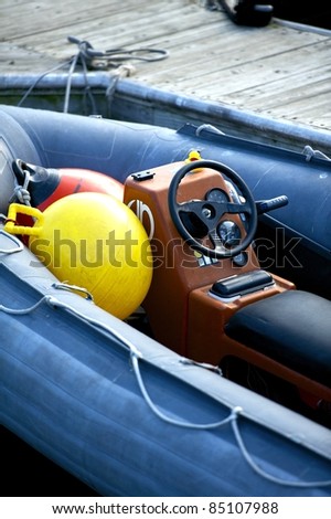 Small Rescue Motor Boat. Water Transportation Photo Collection. Vertical Motorboat Photo.