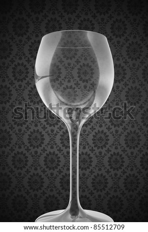 Empty Wine Glass on Retro Gray Background. Simple Wine Theme - Grayscale.