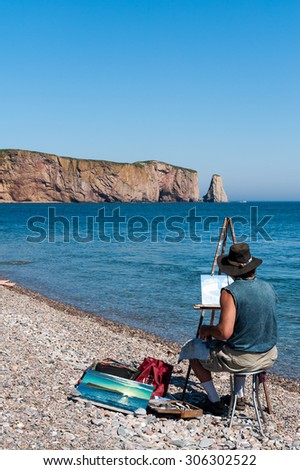 PERCE CANADA-August 19,2011:  Landscape painter painting Perce Rock in the Gulf of St Lawrence, Gaspe Peninsula in Quebec, Canada on August 19th 2011