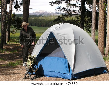 Senior man camping in Devil Tower National Park, USA