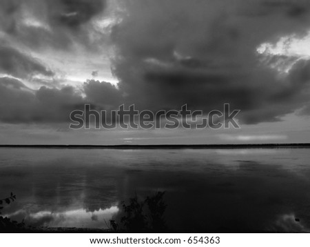 Clouds reflections in black and white on Nova Scotia coastline, Canada   - natural grain