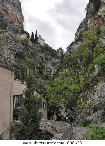 Tourists on their way to visit the medieval church located in the mountain top. Village Moustier-Sainte-Marie, Gorges of Verdon, the great French canyon, Alps-Haute-Provence, France