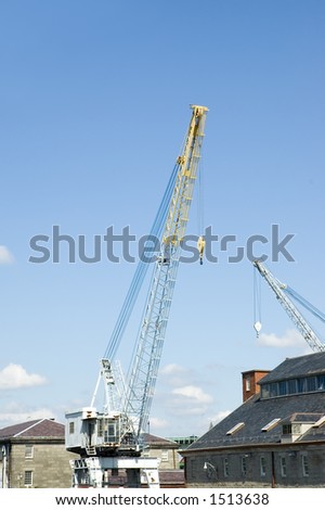 Industrial cranes  half yellow and half white for boat on Boston harbor, Massachusetts
