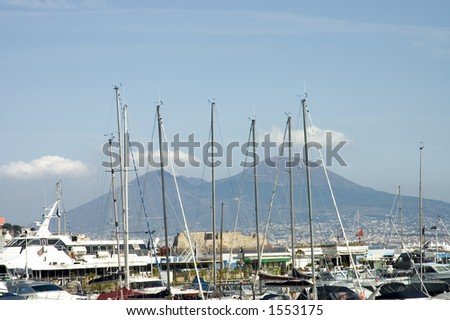 The crowded Mergellina port of Naples,(part of Campania)  with Vesuvius behind the masts, Italy. Naples is listed by UNESCO as a World Cultural Heritage site.