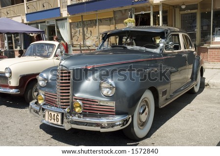 An old  1946 American  car shined and polished as new exhibited in street of Quebec, Canada