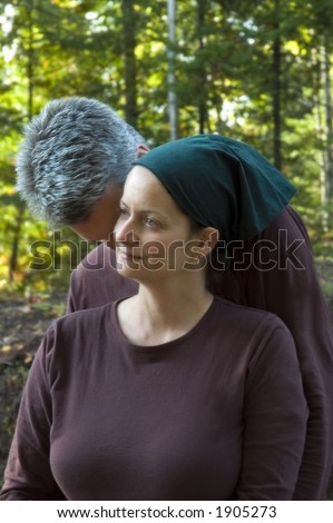 man and woman whispering sweet secrets