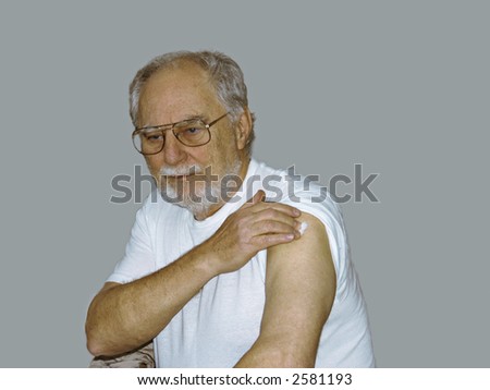 senior receiving his yearly vaccine against the flu