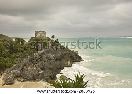 Maya temple ruins over the rocks in Caribbean sea, Tulum sites, Mexico,