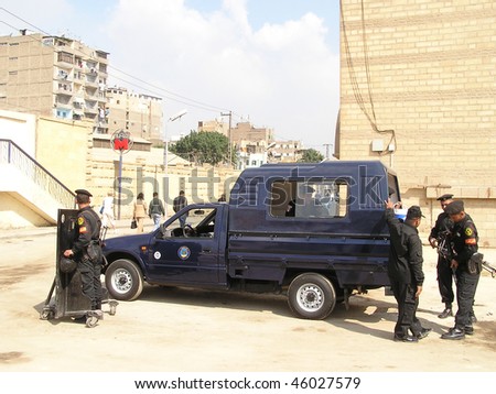 CAIRO - MARCH 15: Egyptian policemen check their guns in a high security area of Cairo March 16, 2005 in Cairo.