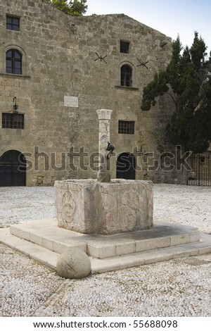 Fifth century Baptistery fountain fronting the History Library in Rhodes, Crete Island, Greece