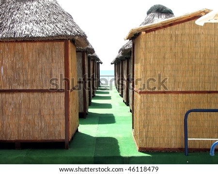 Beach houses with light organic material on the green cover