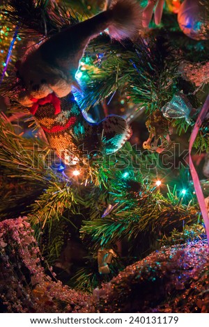 Decorations and multi colored lights on the Christmas tree