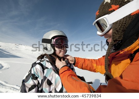 Safety ski mom putting a helmet Areches, Savoie, France
