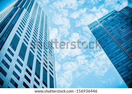 Skyscraper on the sky. Blue filter