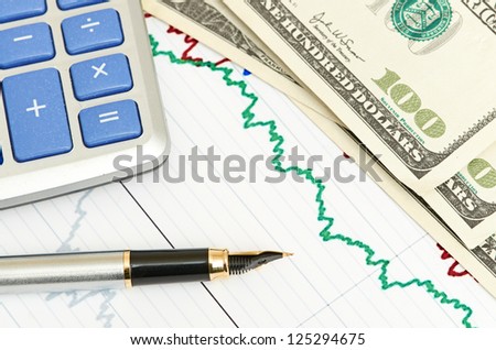 Pen, calculator and dollars